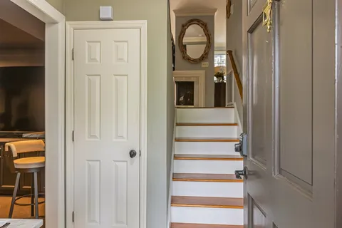 a view of entryway with wooden floor