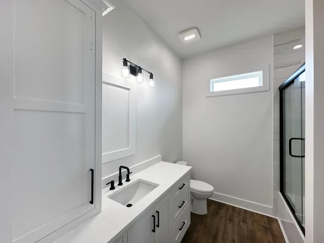 a view of room window and wooden floor
