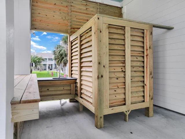 a kitchen with granite countertop a refrigerator and a stove top oven