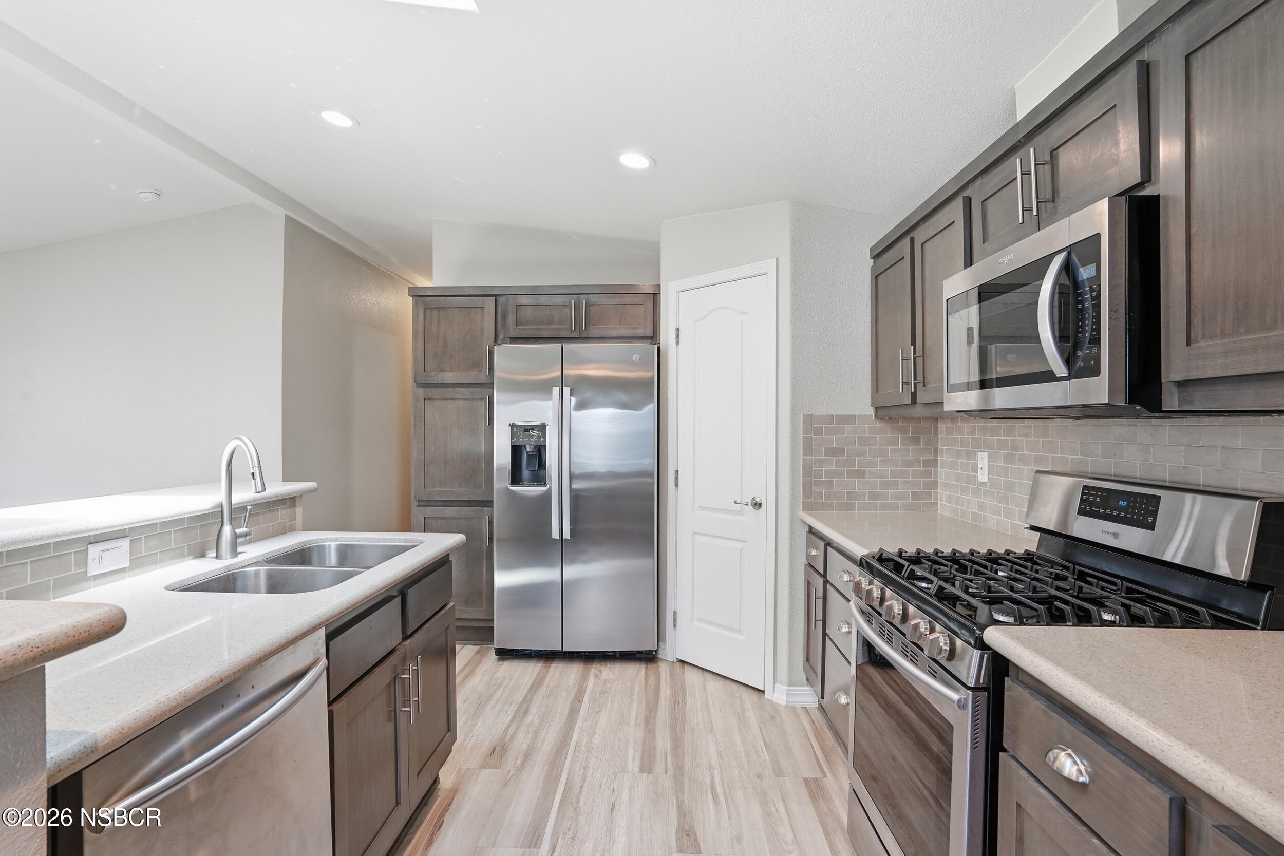 500 Atascadero Road, Unit M3 Morro Bay, CA 93442 - Photo 9 of 29 a kitchen with stainless steel appliances granite countertop a sink stove and refrigerator