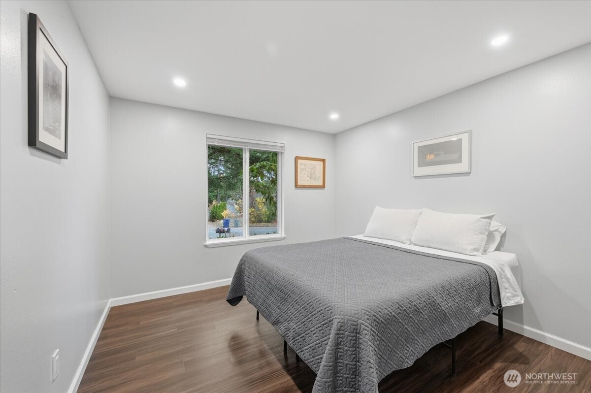 611 216th Street Southwest Bothell, WA 98021 - Photo 13 of 22 a bedroom with a bed and a window