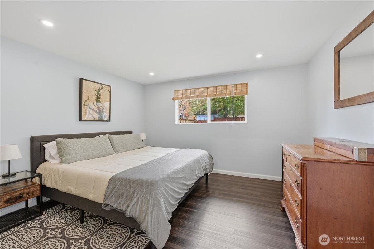 611 216th Street Southwest Bothell, WA 98021 - Photo 14 of 22 a bedroom with a bed and a night stand