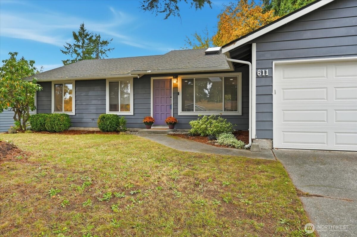 611 216th Street Southwest Bothell, WA 98021 - Photo 2 of 22 a front view of a house with garden