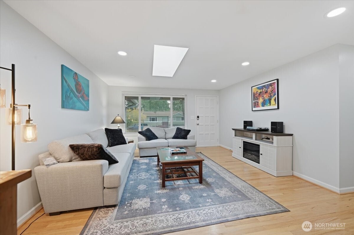 611 216th Street Southwest Bothell, WA 98021 - Photo 4 of 22 a living room with furniture and a rug