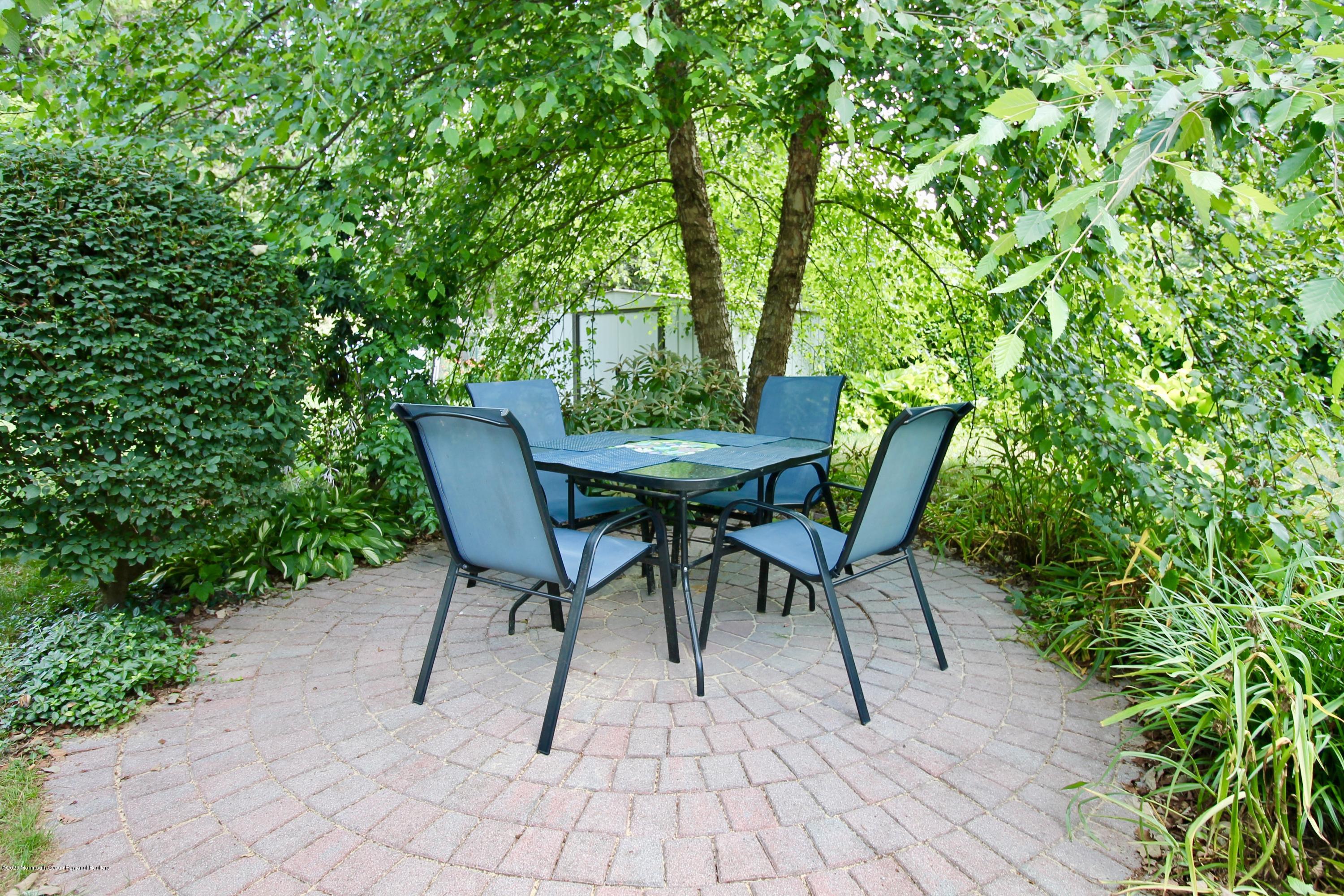 4 Schiverea Avenue Freehold, NJ 07728 - Photo 29 of 36 PAVER PATIO DINING AREA