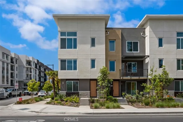a front view of a multi story residential apartment building