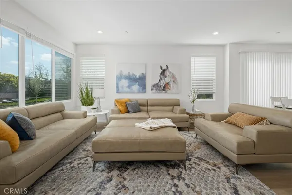 a living room with furniture and a large window