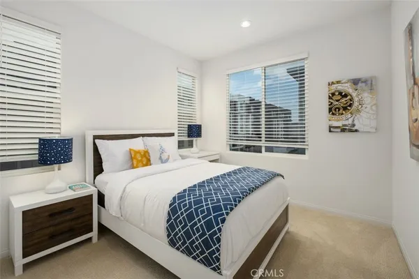 a bedroom with bed and a window