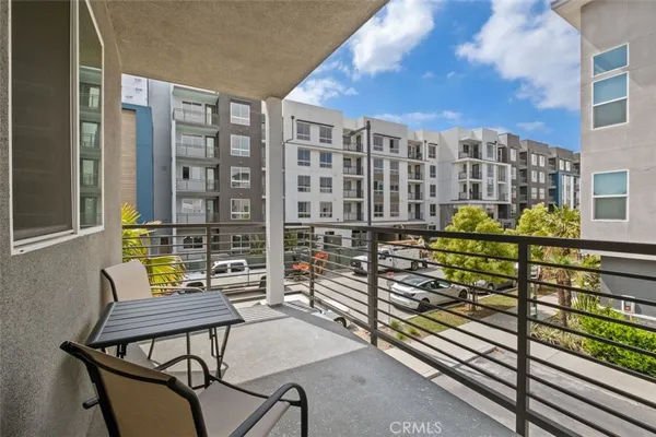 a view of a balcony with chairs