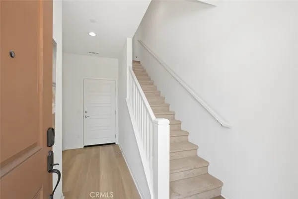 a view of a hallway with staircase