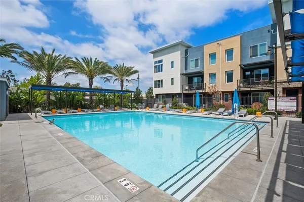 a view of swimming pool with outdoor seating