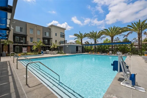 a view of a swimming pool with a table and chairs