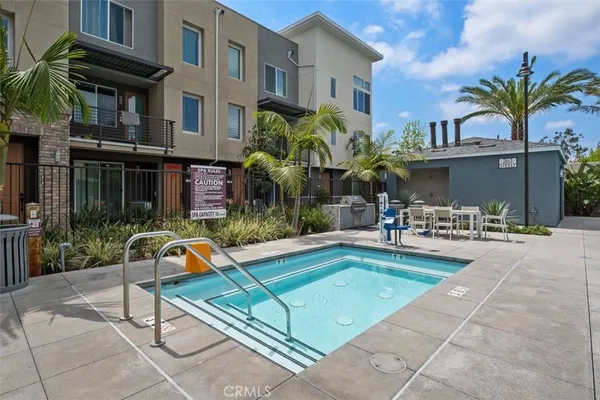 a view of a patio with a table and chairs