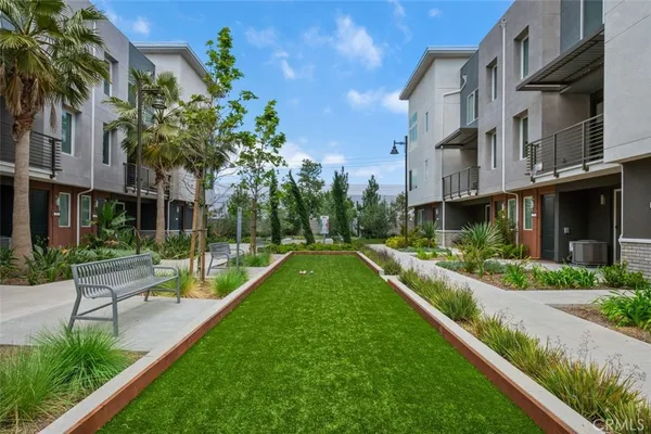a view of a house with a yard patio and swimming pool