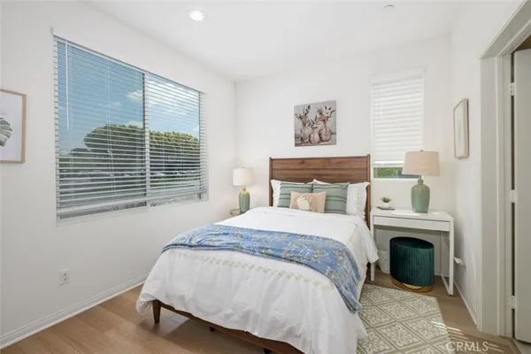 a bed room with a bed and a chair