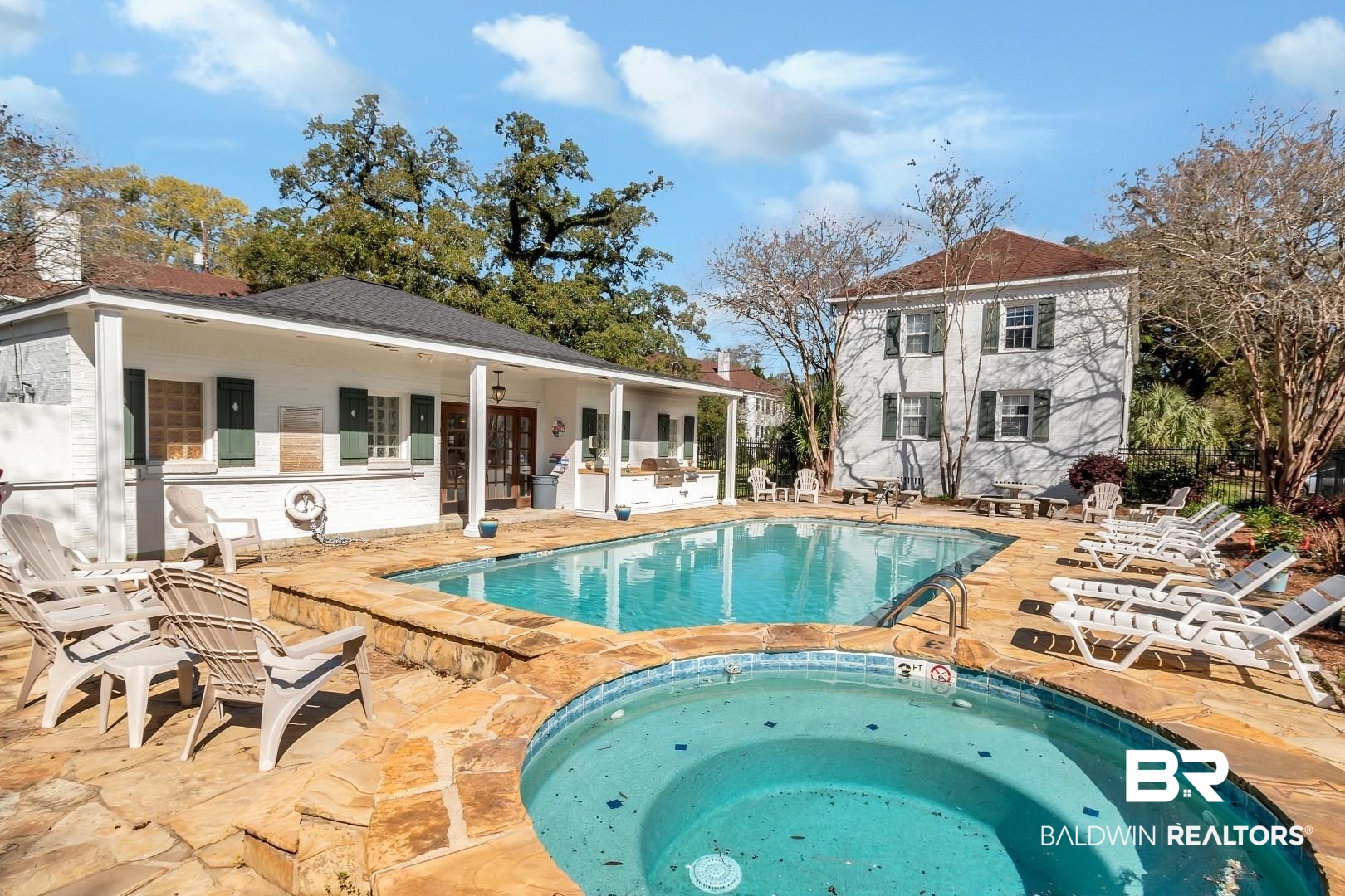 214 Upham Street, Unit 4A Mobile, AL 36607 - Photo 6 of 23 Community pool featuring a patio, a community hot tub, and fence