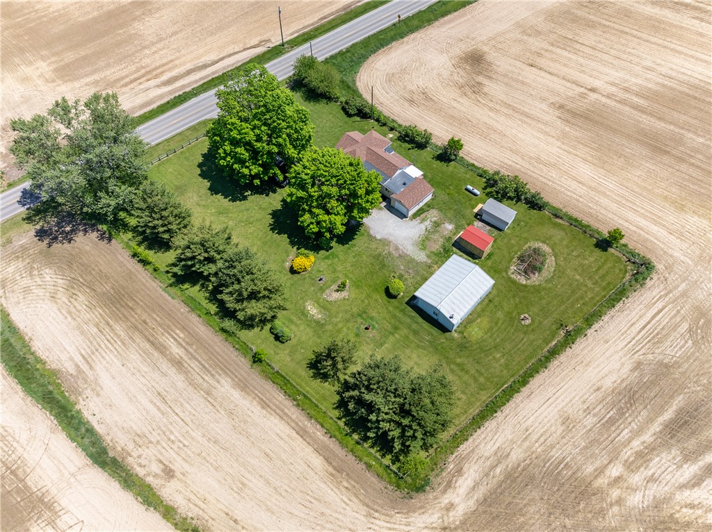 1217 Jasper Road Xenia, OH 45385 - Photo 6 of 62 An aerial view captures a sprawling property nestled amidst vast agricultural fields.