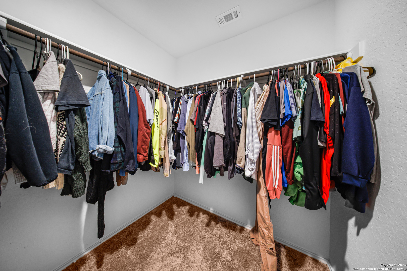 5424 Thyme Corner St. Hedwig, TX 78152 - Photo 20 of 21 a view of walk in closet with clothes and shoes