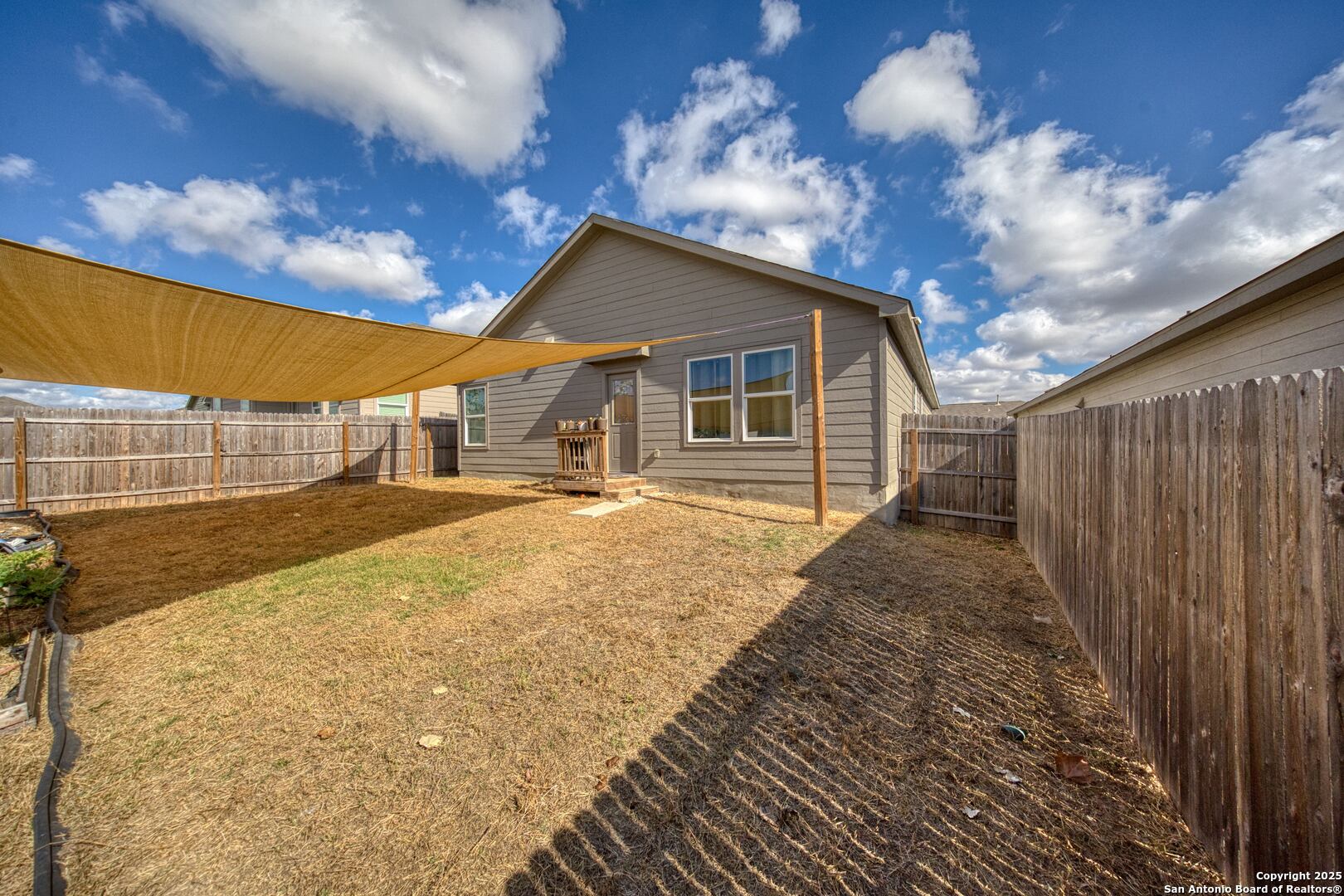 5424 Thyme Corner St. Hedwig, TX 78152 - Photo 21 of 21 a backyard of a house with table and chairs