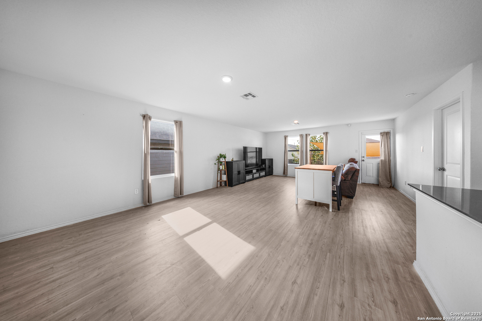 5424 Thyme Corner St. Hedwig, TX 78152 - Photo 4 of 21 a living room with furniture and a wooden floor