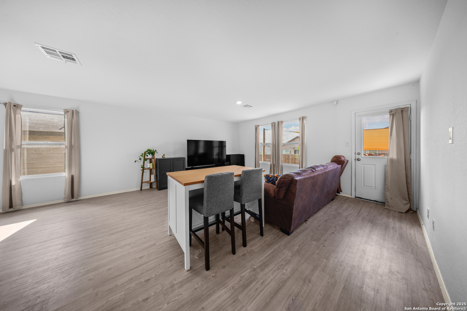 5424 Thyme Corner St. Hedwig, TX 78152 - Photo 9 of 21 a living room with furniture and a wooden floor