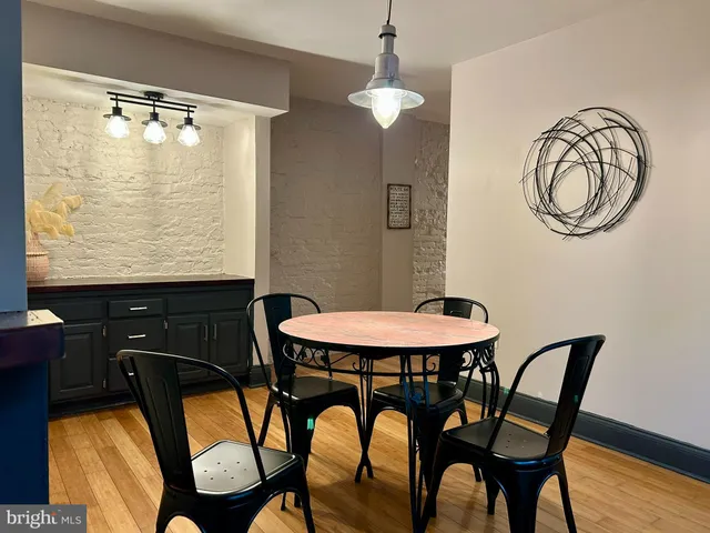 a view of a dining room with furniture and chandelier