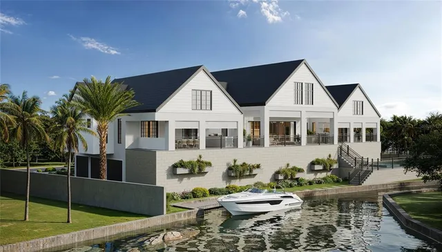 a front view of a house with a yard and fountain