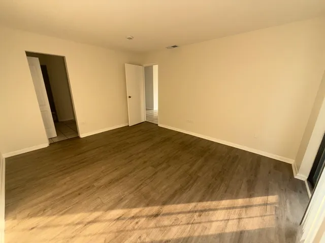 a white toilet sitting next to a bath tub