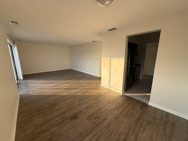 a kitchen with stainless steel appliances a sink stove and cabinets
