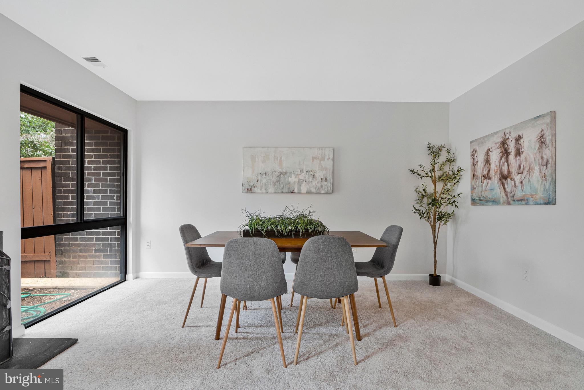 2005 Wethersfield Court Reston, VA 20191 - Photo 12 of 43 a view of a dining room with furniture and a large window