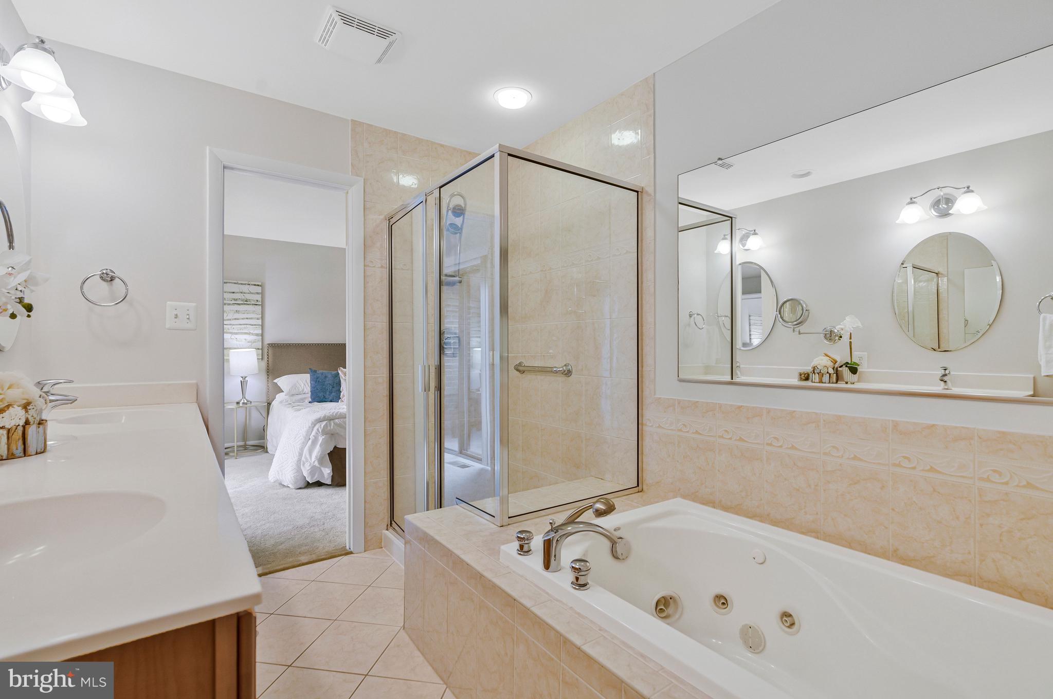 2005 Wethersfield Court Reston, VA 20191 - Photo 24 of 43 a bathroom with a bathtub and a shower