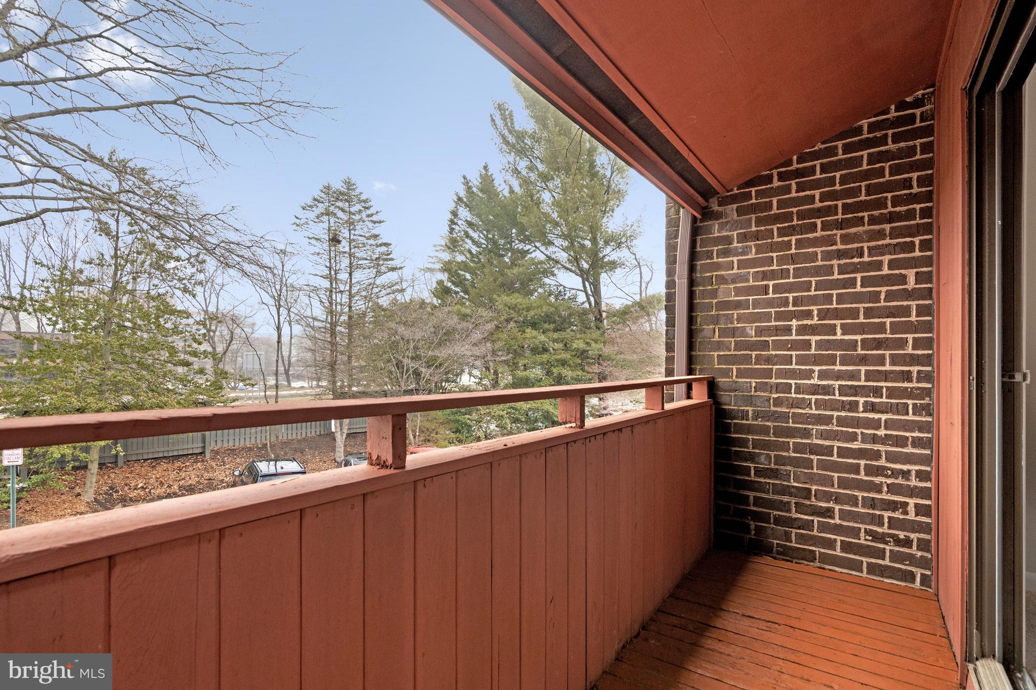 2005 Wethersfield Court Reston, VA 20191 - Photo 26 of 43 a view of balcony with wooden floor and fence