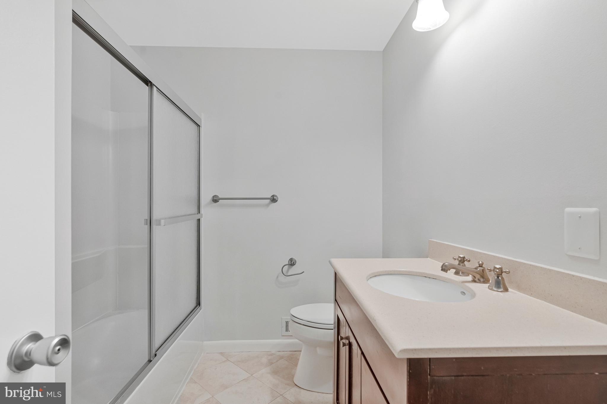 2005 Wethersfield Court Reston, VA 20191 - Photo 33 of 43 a bathroom with a sink toilet and shower