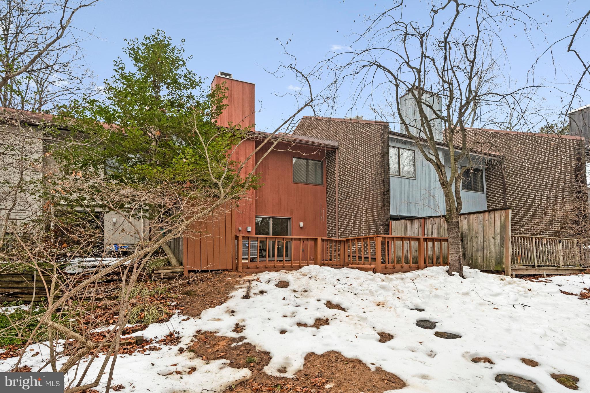 2005 Wethersfield Court Reston, VA 20191 - Photo 42 of 43 a view of a house with a snow in the yard