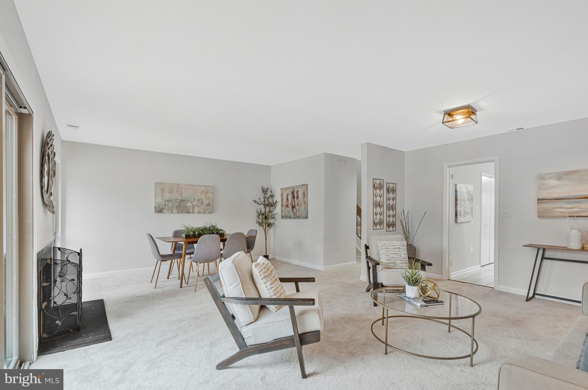 2005 Wethersfield Court Reston, VA 20191 - Photo 7 of 43 a living room with furniture and a painting on the wall
