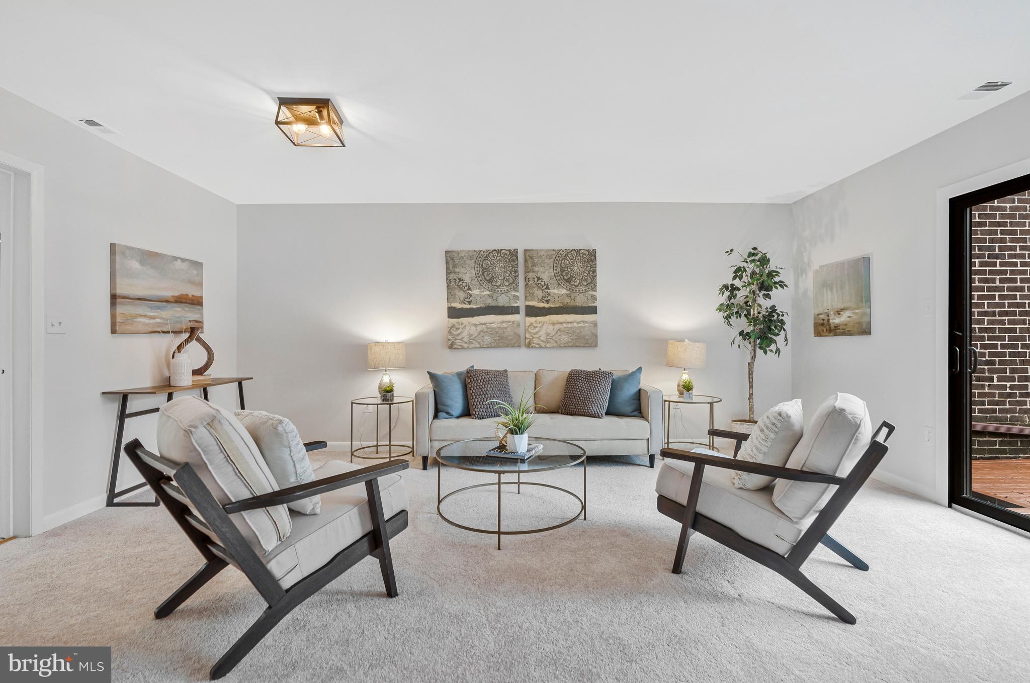 2005 Wethersfield Court Reston, VA 20191 - Photo 8 of 43 a living room with furniture and a potted plant
