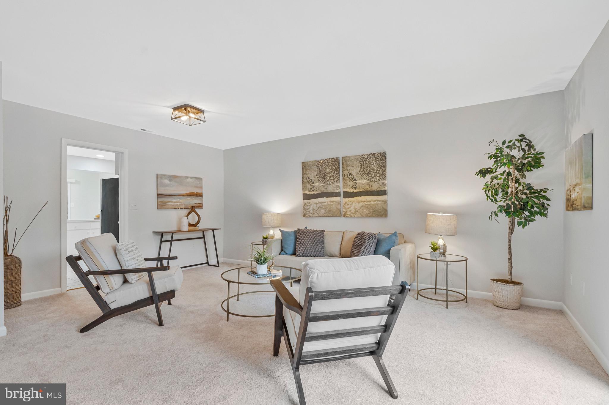 2005 Wethersfield Court Reston, VA 20191 - Photo 9 of 43 a living room with furniture and a potted plant