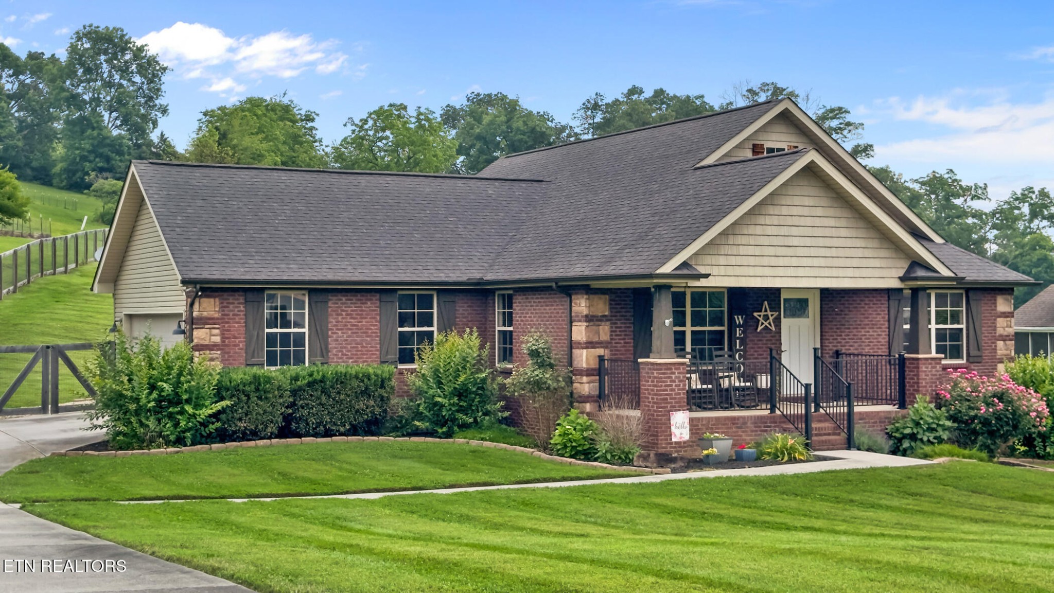 8012 Campbells Point Road Corryton, TN 37721 - Photo 2 of 39 a front view of a house with a yard