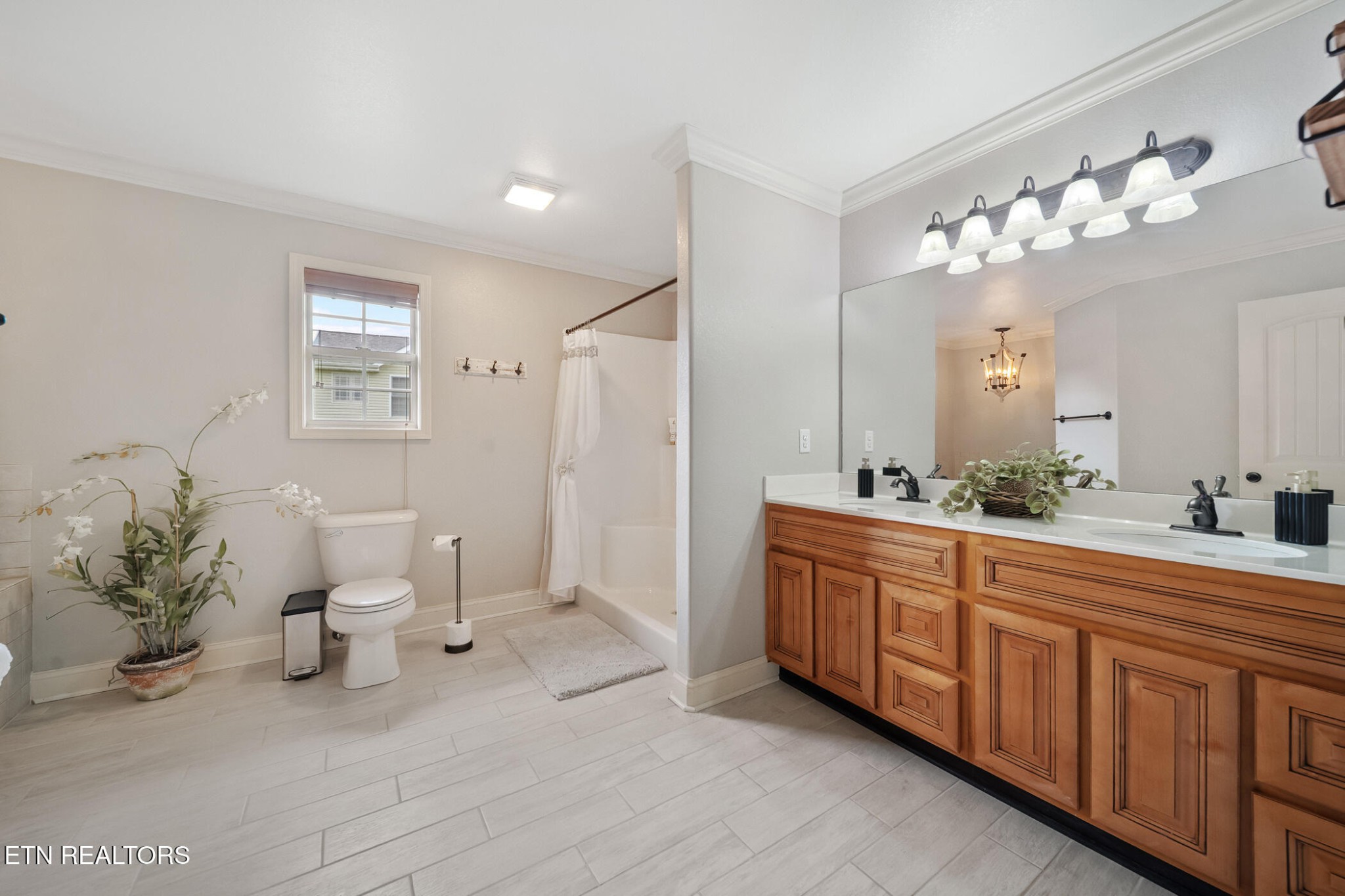 8012 Campbells Point Road Corryton, TN 37721 - Photo 21 of 39 a spacious bathroom with a double vanity sink mirror and toilet