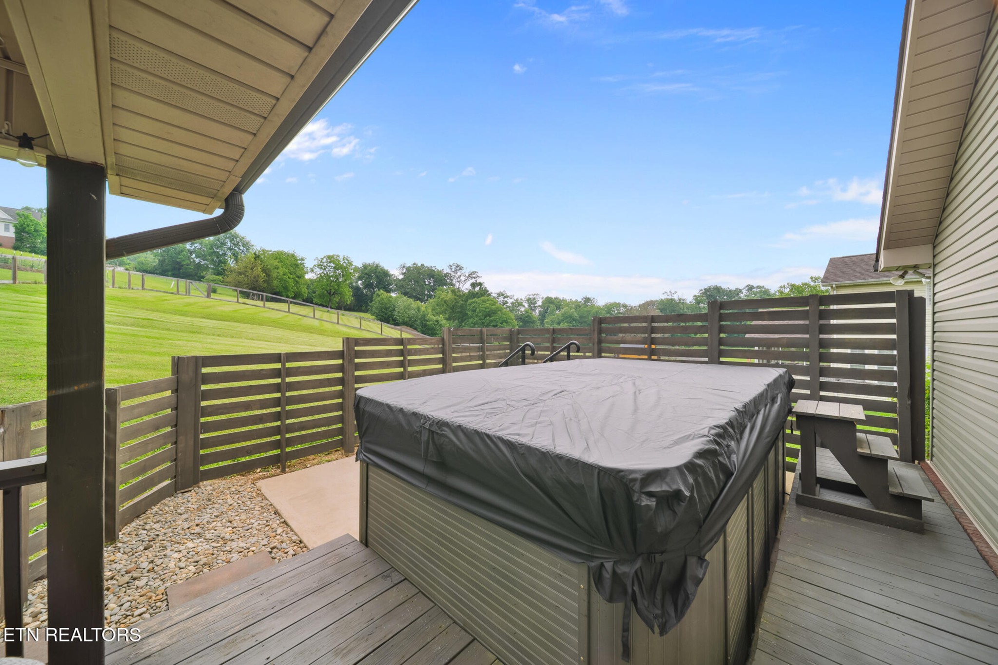 8012 Campbells Point Road Corryton, TN 37721 - Photo 27 of 39 a view of a roof deck with wooden floor and fence