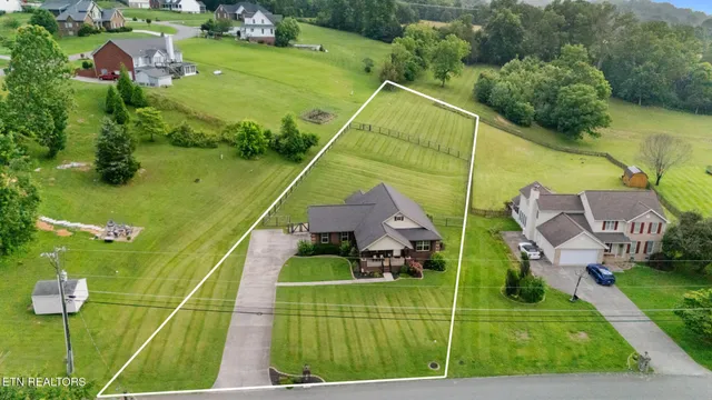 a view of yard from deck having patio