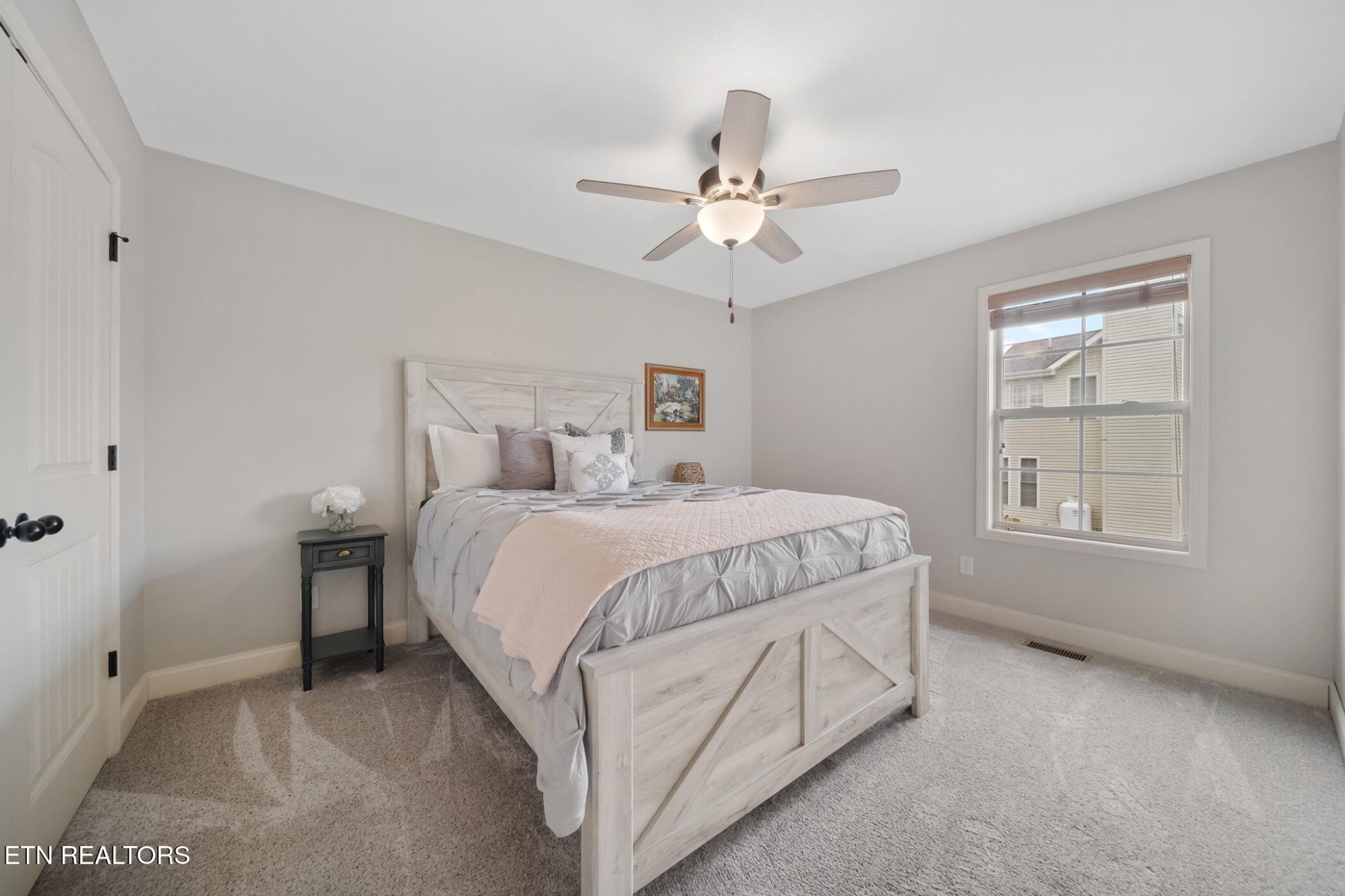 8012 Campbells Point Road Corryton, TN 37721 - Photo 31 of 39 a spacious bedroom with a bed and a window
