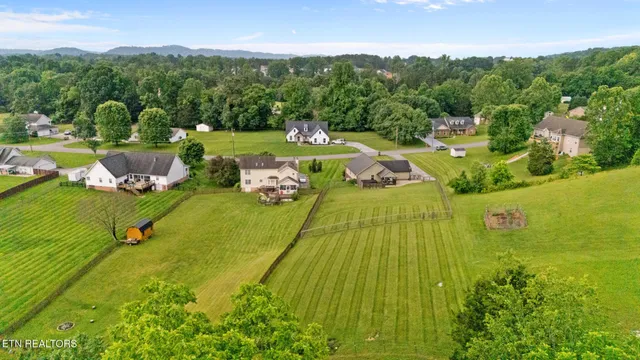 a view of an house with a big yard