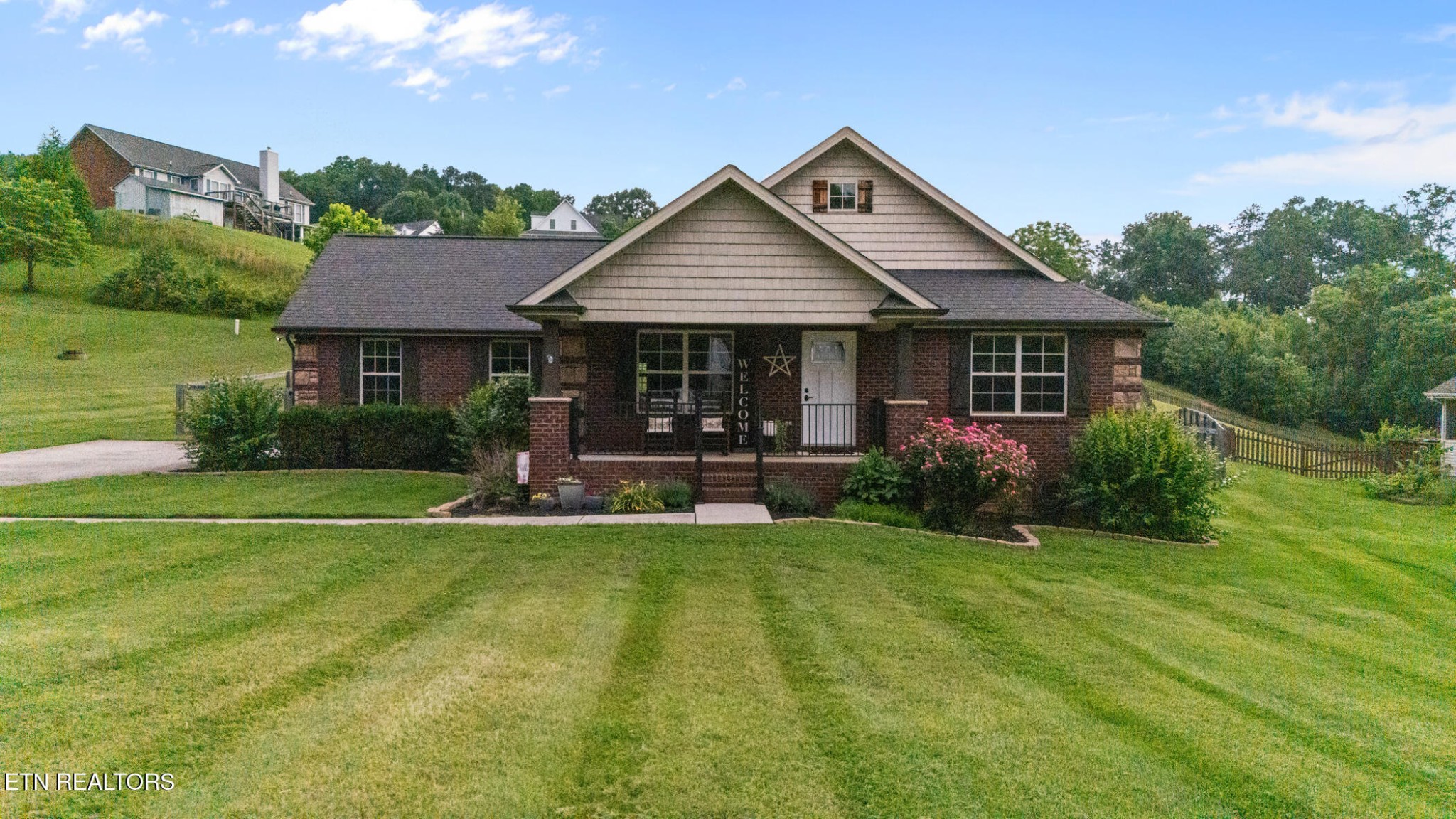 8012 Campbells Point Road Corryton, TN 37721 - Photo 37 of 39 a view of a house with a yard patio and plants