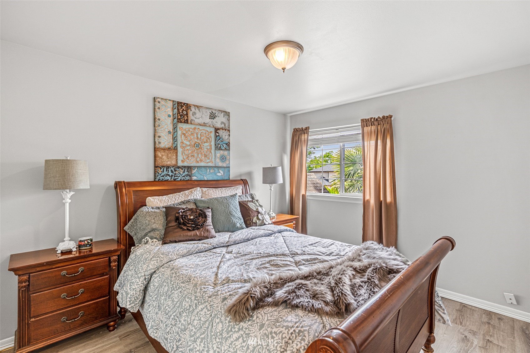 659 Orcas Avenue Northeast Renton, WA 98059 - Photo 28 of 40 a bedroom with a bed and wooden floor