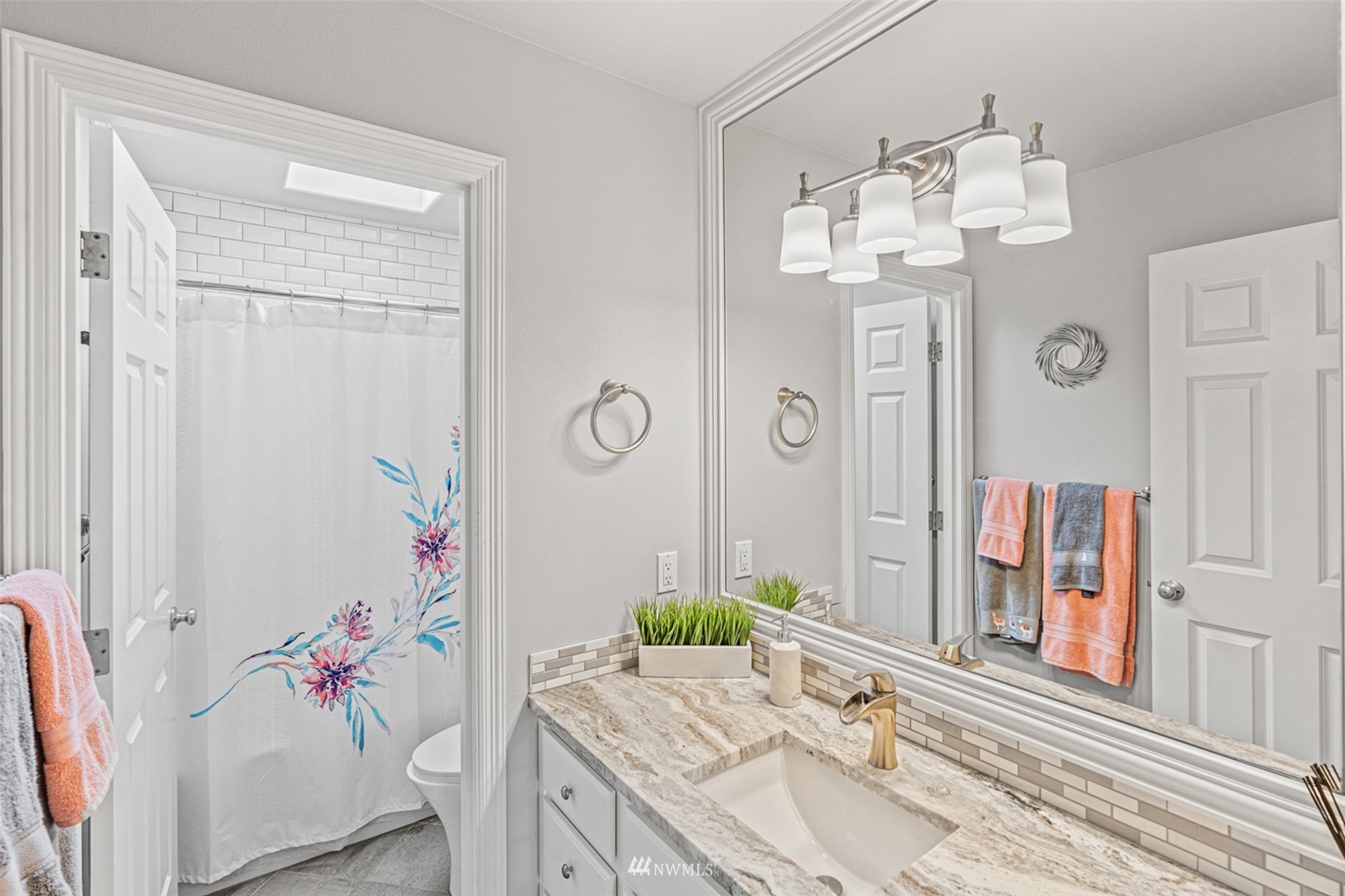 659 Orcas Avenue Northeast Renton, WA 98059 - Photo 29 of 40 a bathroom with a granite countertop sink and a mirror