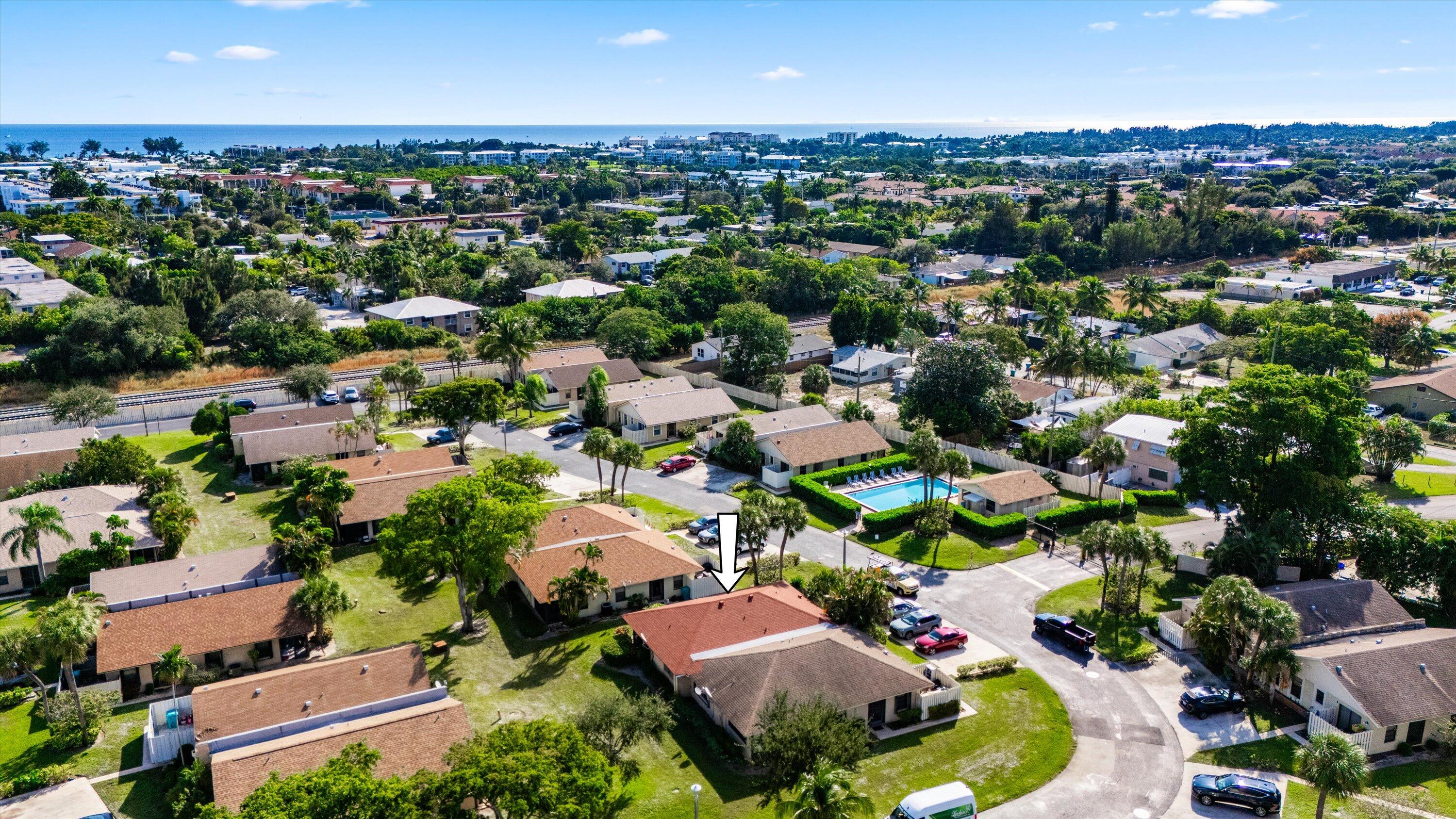 197 Southeast 1st Circle, Unit 15B Boynton Beach, FL 33435 - Photo 23 of 26 an aerial view of a houses with a lake