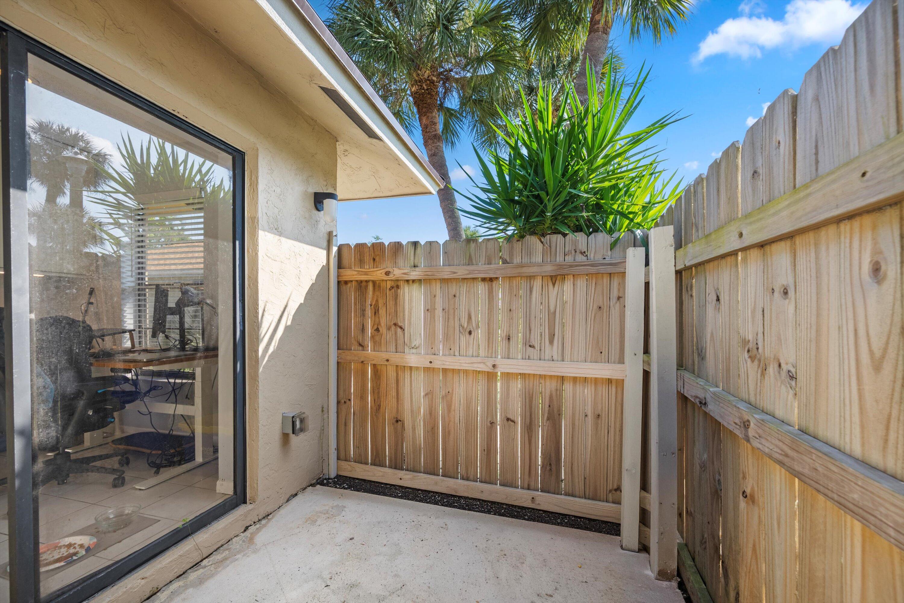197 Southeast 1st Circle, Unit 15B Boynton Beach, FL 33435 - Photo 4 of 26 a view of a house with a backyard