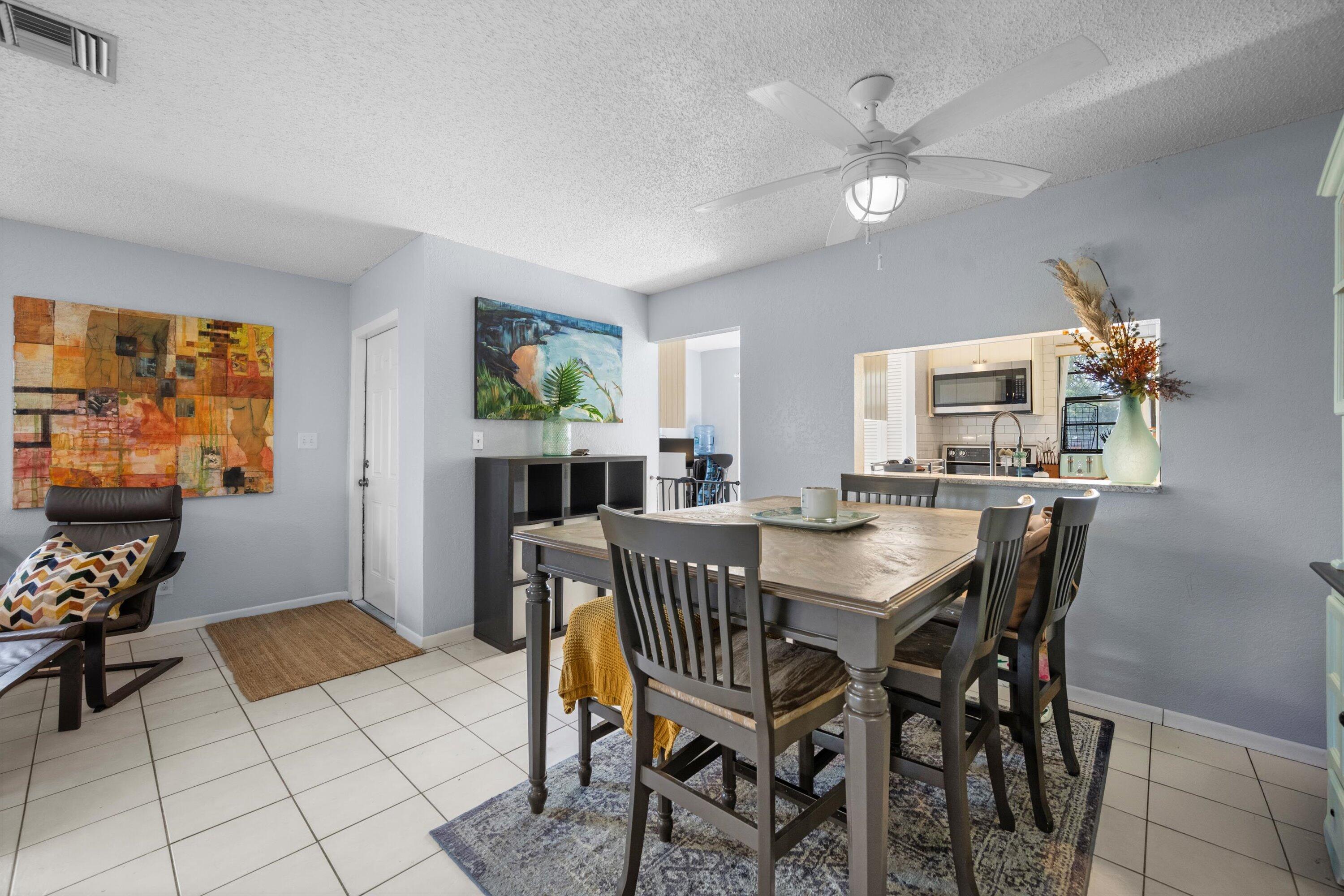 197 Southeast 1st Circle, Unit 15B Boynton Beach, FL 33435 - Photo 8 of 26 a view of a dining room with furniture window and outside view