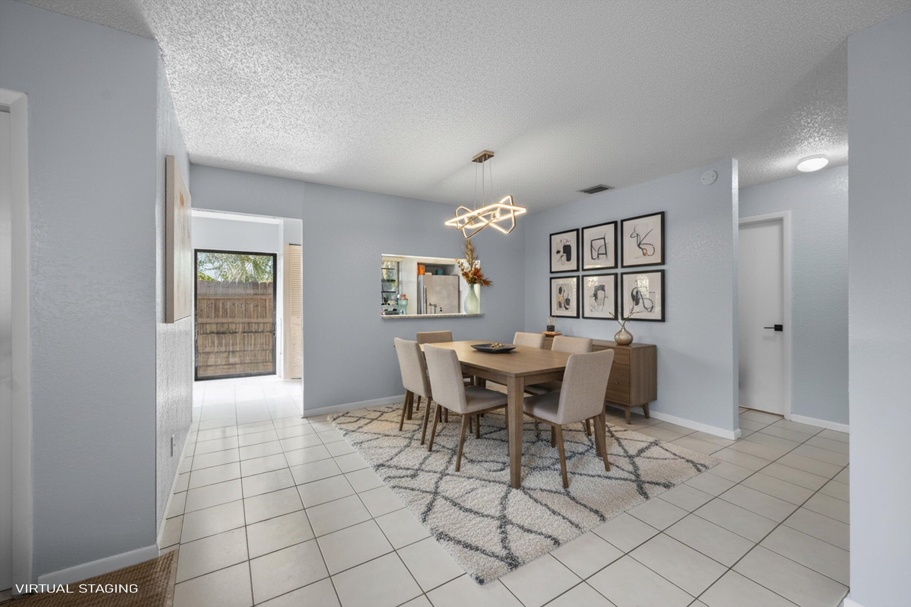 197 Southeast 1st Circle, Unit 15B Boynton Beach, FL 33435 - Photo 9 of 26 a dining room with furniture and window